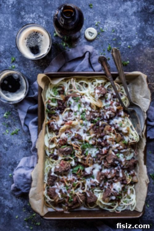 Guinness and Black Bean Chili Fries 6 Overhead view of a vibrant spread of Guinness and Black Bean Chili Loaded Spiralized Fries, garnished with fresh chives, ready to be enjoyed