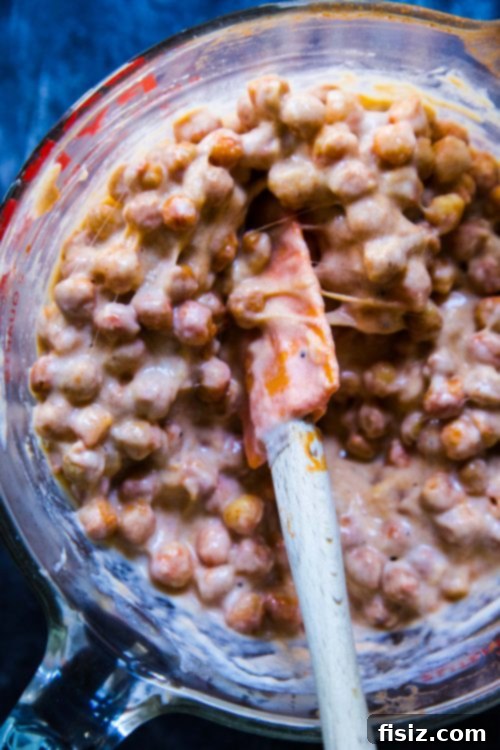 Vegan Buffalo Chickpea Mac 4 A bowl of roasted chickpeas coated in buffalo sauce, ready to be mixed into the mac and cheese.