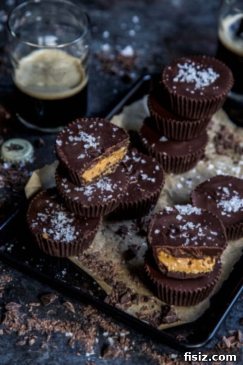Dark Chocolate Stout Peanut Butter Cups 5 A Dark Chocolate Peanut Butter Guinness Cup being decorated with a final sprinkle of sea salt flakes