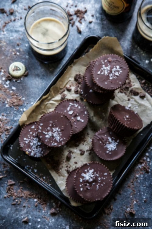 Dark Chocolate Stout Peanut Butter Cups 6 Several finished Dark Chocolate Peanut Butter Guinness Cups unwrapped and arranged on a white serving dish