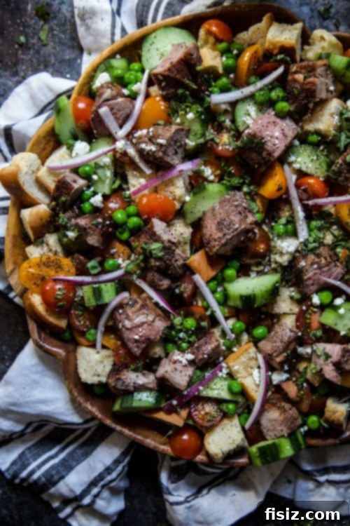 Za'atar Lamb Panzanella Salad 5 Serving of Lamb Za'atar Panzanella Salad garnished with feta cheese