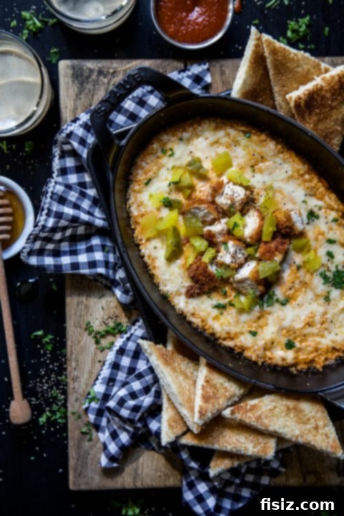 Sweet Heat Chicken Dip with Honey Butter Toasts 5 Hot Chicken Dip served in a baking dish, ready for honey toasts.