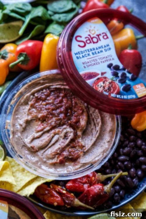 Mediterranean Bean Mezze Platter 5 Close-up of Sabra Black Bean with Roasted Tomato & Paprika dip, highlighting its dark color and smoky seasoning.