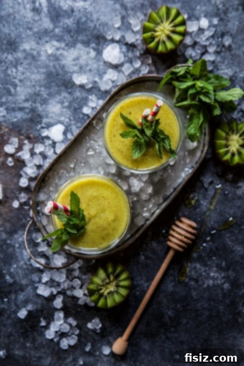 Vibrant Turmeric Pineapple Kiwi Mint Smoothie 5 Freshly blended Kiwi Pineapple Turmeric Smoothie
