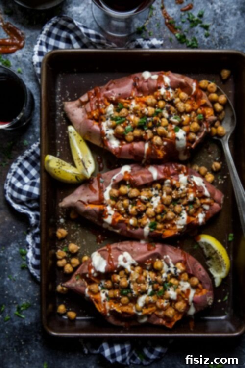 Ginger-Tahini Sweet Potato Boats with Toasted Sesame Chickpea 2 Stuffed sweet potato with chickpeas and tahini