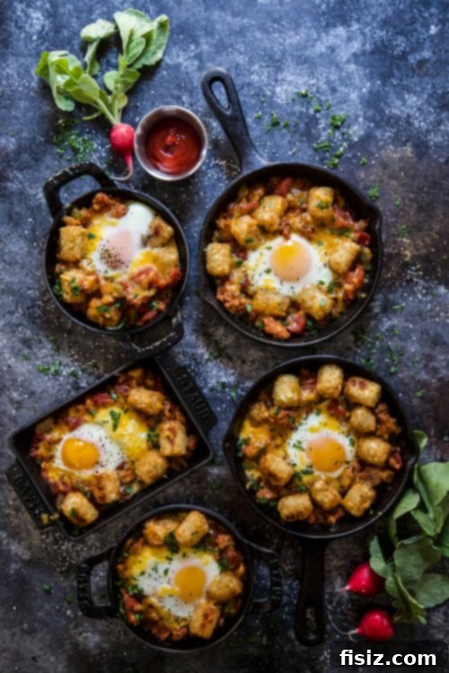 Crispy Tot Shakshuka 6 Another perspective of the Tot Shakshuka, highlighting the golden brown tots and the rich, bubbling tomato sauce.
