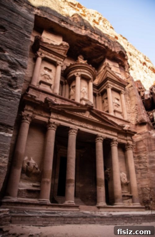 Petra Jordan Stay Dine and Discover the Rose City 15 Tourists admiring The Treasury in the morning light