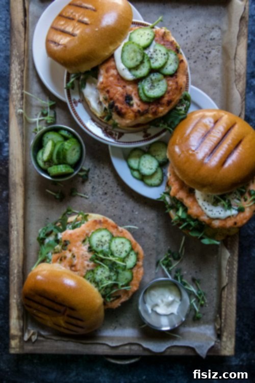 Easy Ginger Salmon Burgers and Crisp Pickled Cucumbers 2 Easy Ginger Salmon Burgers with Pickled Cucumbers on a plate