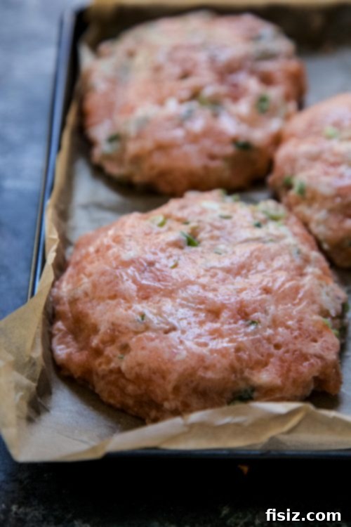 Easy Ginger Salmon Burgers and Crisp Pickled Cucumbers 4 Freshly prepared Ginger Salmon Burgers with Pickled Cucumbers on buns