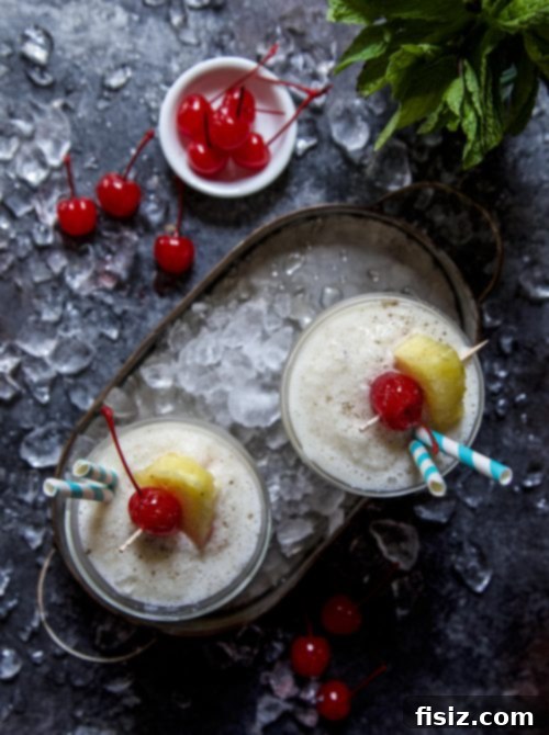 Refreshing Cardamom Rum Pina Colada in a Glass