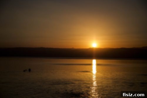 Dead Sea Jordan Accommodations Dining and Attractions 3 Panoramic view of the Dead Sea from a high vantage point, showing the vast expanse of water