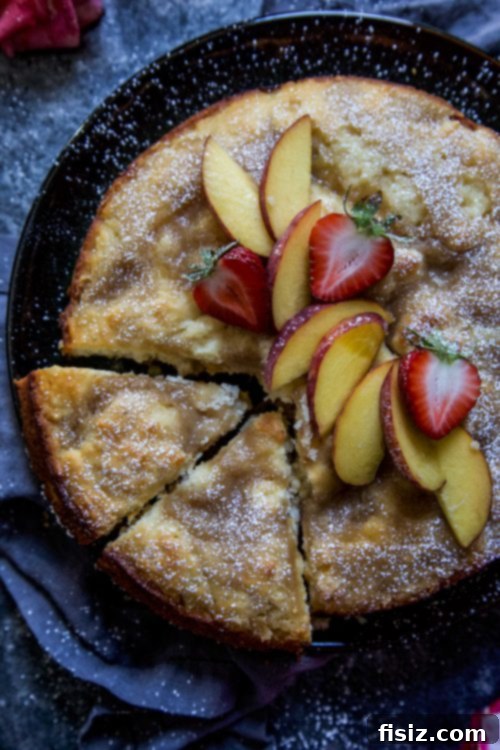 Strawberry Peach Tahini Cake 3 Close-up of a slice of Strawberry and Peach Tahini Cake with fresh fruit