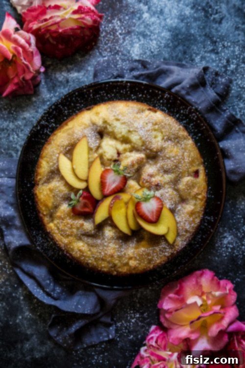 Strawberry Peach Tahini Cake 5 Full view of a baked Strawberry and Peach Tahini Cake ready for slicing