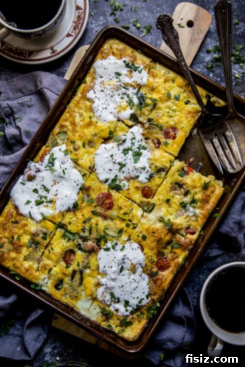 Farm Fresh Sheet Pan Frittata 3 Overhead shot of fresh eggs, vegetables, and sausage laid out on a kitchen counter