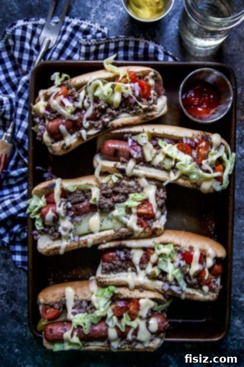 Indulgent Cheeseburger Dogs 2 Delicious Loaded Cheeseburger Hot Dogs ready for a summer party