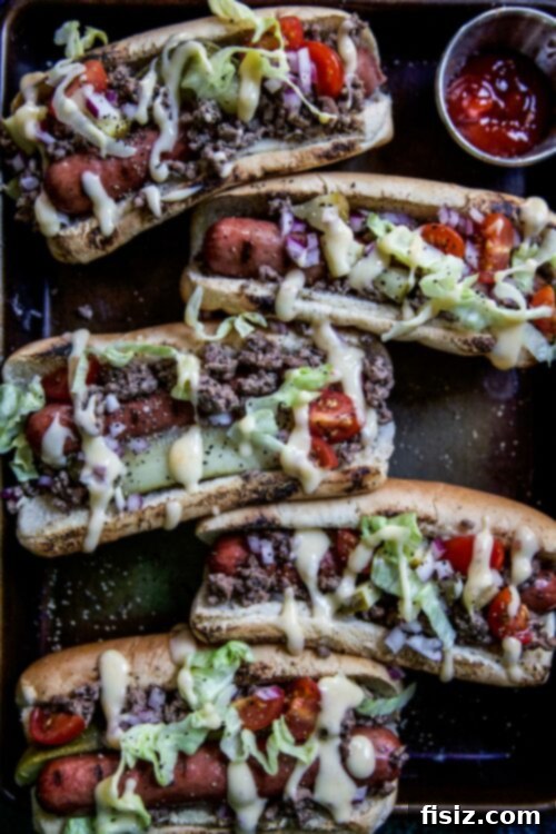 Indulgent Cheeseburger Dogs 3 Close-up of a Loaded Cheeseburger Hot Dog with all toppings