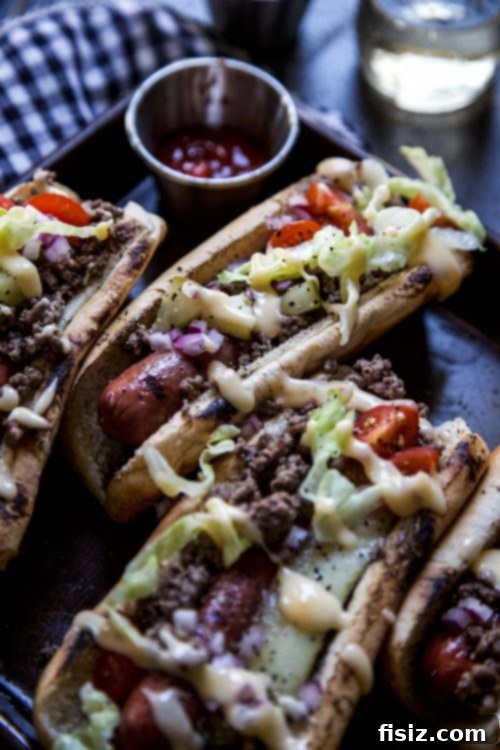 Indulgent Cheeseburger Dogs 5 Loaded Cheeseburger Hot Dog in a bun, ready to eat