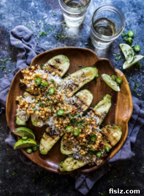 Taiwanese Grilled Corn Zucchini Boats 6 Stuffed zucchini boats garnished with sesame seeds and jalapeños, ready to serve