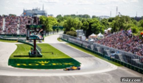 Two Formula 1 cars racing side-by-side on the circuit, highlighting the close competition.