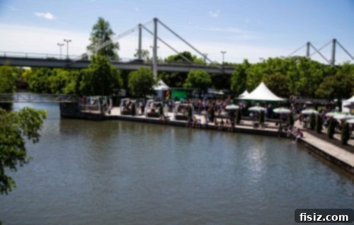 Heineken branded bar tent at the F1 event, serving drinks to a crowd of attendees.