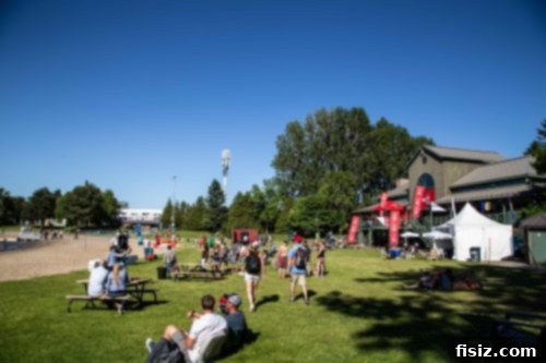 People playing outdoor games and relaxing in a green area at the F1 fan zone.