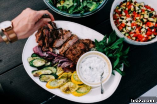 Zesty Grilled Butterflied Leg of Lamb 12 Grilled citrus butterflied leg of lamb sizzling on an outdoor grill