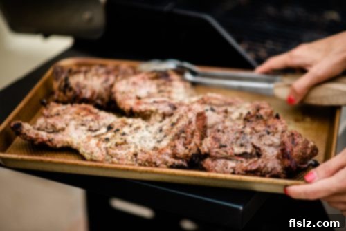 Zesty Grilled Butterflied Leg of Lamb 9 Raw butterflied leg of lamb laid flat on a cutting board, ready for marinating