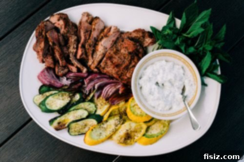 Zesty Grilled Butterflied Leg of Lamb 10 Fresh marinade ingredients, including herbs, lemon, onion, and garlic, in a food processor
