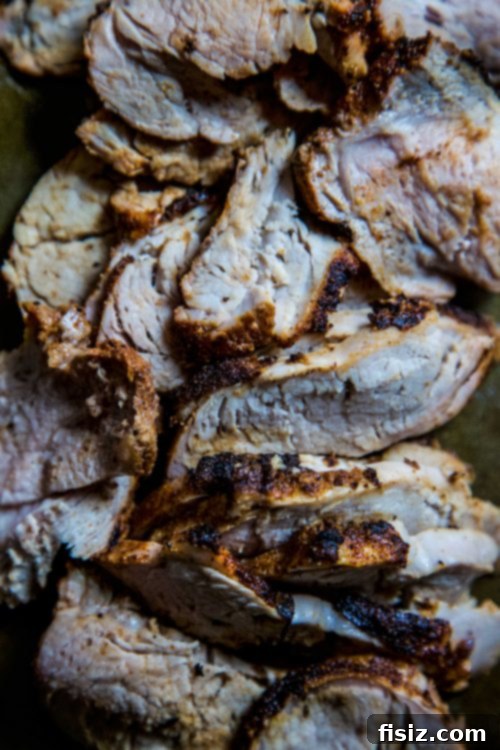 Succulent Grilled Pork Tacos with Bright Corn-Okra Relish 5 Chef slicing grilled pork tenderloin for tacos on a cutting board