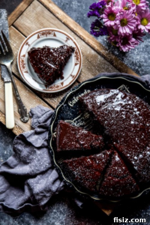 Decadent Dark Chocolate Whiskey Indulgence 6 Plated slice of Dark Chocolate Whiskey Cake ready to be enjoyed