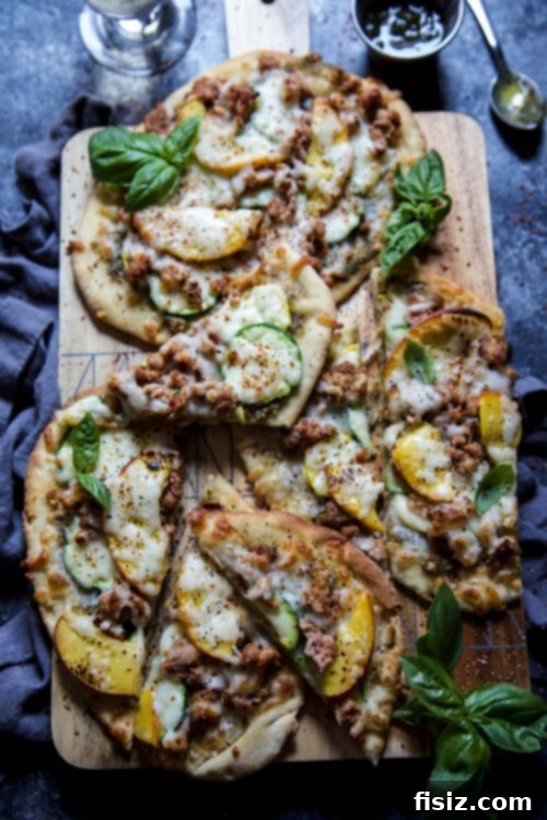 Sweet and Savory Chicken Pesto Flatbread with Summer Peaches and Squash 5 Close-up of fully assembled chicken pesto flatbreads, ready for the oven.