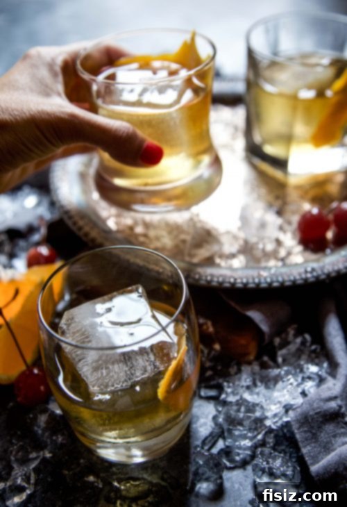 Turkish Classics 5 Two Turkish Old Fashioned cocktails in glasses with ice and garnishes.