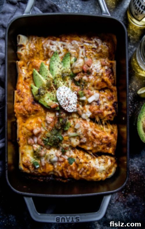 Effortless Hatch Chile Veggie Enchiladas 3 Close-up of roasted butternut squash and diced yellow onions on a baking sheet