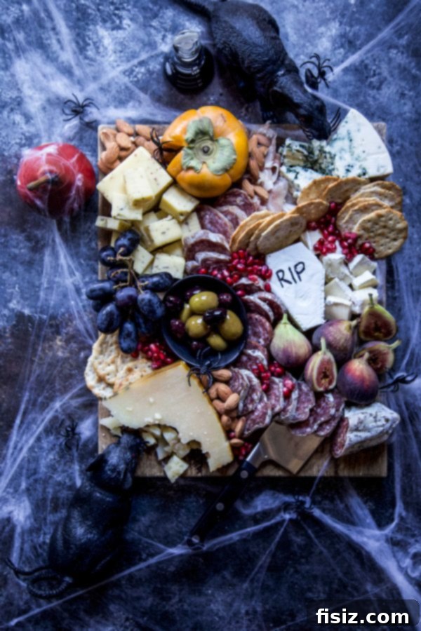 Crafting a Killer Halloween Charcuterie Board 2 A Halloween charcuterie board decorated with intricate cobwebs, plastic spiders, and miniature black rats, set against a dark, atmospheric background.
