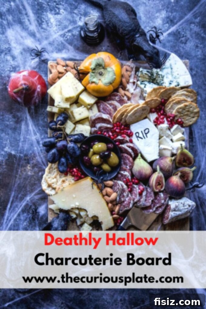 Crafting a Killer Halloween Charcuterie Board 6 A wide shot of the Deathly Hallows Halloween Charcuterie Board, featuring cheeses, meats, fruits, nuts, and spooky decorations, ready for a party.