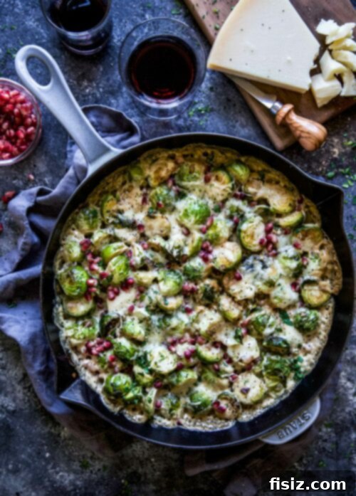 Vegetarian Brussels Sprout Bake with Parmesan and Pomegranates, a savory and festive dish perfect for Thanksgiving.