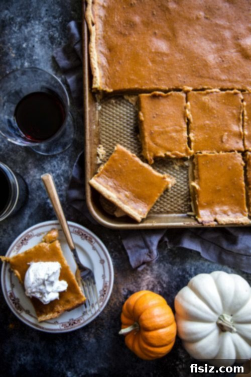 rolling out pie dough onto a sheet pan, showing how multiple dough sheets are combined to cover the pan