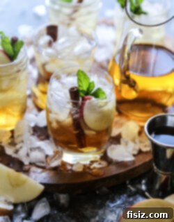 Autumn Apple Mojito 7 Harvest Cider Mojito in a glass with garnishes