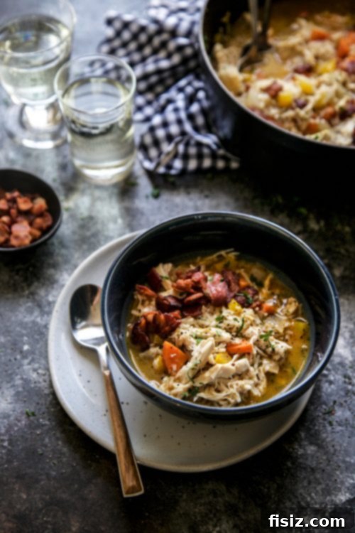 Spicy Peri Peri Turkey and Rice Soup 5 Assortment of fresh ingredients for Peri-Peri Turkey and Rice Soup laid out on a wooden cutting board.
