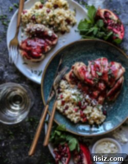 Pomegranate-Ginger Glazed Chicken Thighs 6 Pomegranate and Ginger Glazed Chicken Thighs, garnished with mint and pomegranate arils.