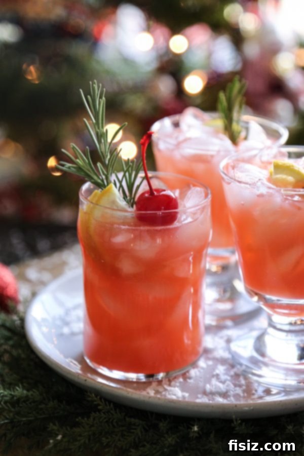 Ingredients for Christmas Morning Punch laid out: oranges, lemons, maraschino cherries, and beverage bottles.