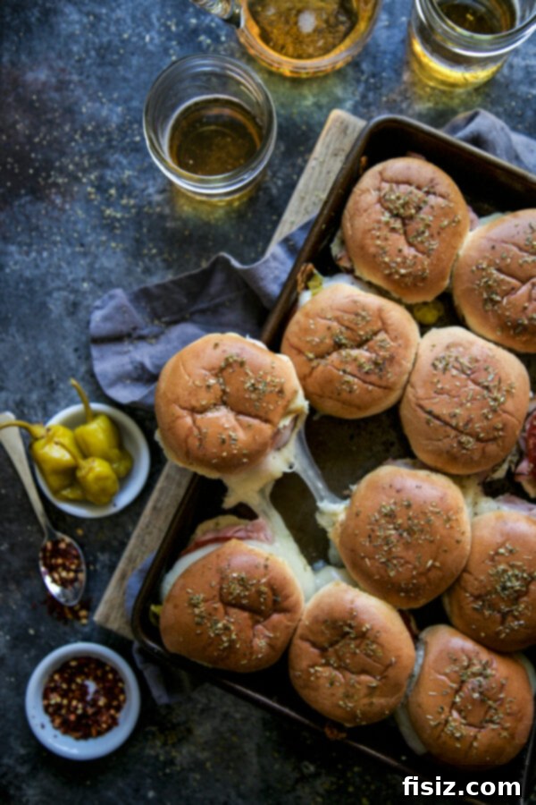 Italian Appetizer Sliders 2 Delicious Antipasto Sliders baked to perfection, ready to serve at a party.