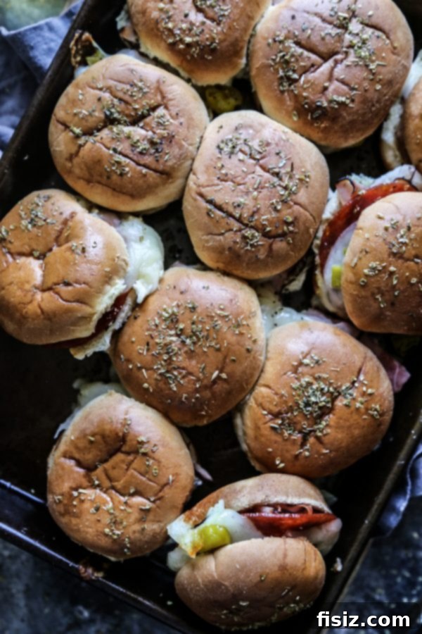 Italian Appetizer Sliders 5 Close-up of baked Antipasto Sliders with melted cheese, fresh out of the oven.