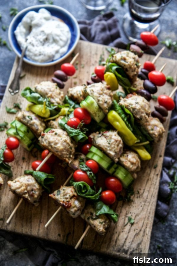 Mediterranean Chicken Meatball Skewers with fresh garnishes