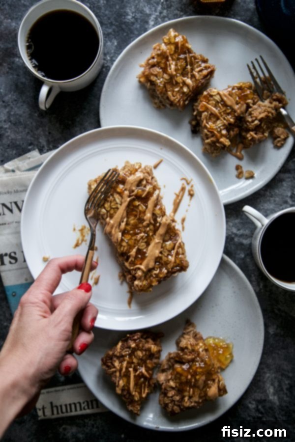 Zesty Peanut Butter and Orange Marmalade Baked Oats 6 Peanut Butter and Orange Marmalade Oatmeal Bake with a spoon
