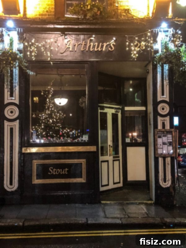 The Ultimate Dublin Guide Stay Dine and Explore Ireland's Capital 16 Interior of a traditional Irish pub, Arthur's Pub, with a cozy atmosphere