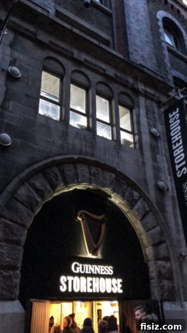 The Ultimate Dublin Guide Stay Dine and Explore Ireland's Capital 35 A perfectly poured pint of Guinness at the Guinness Storehouse, with Dublin cityscape in the background