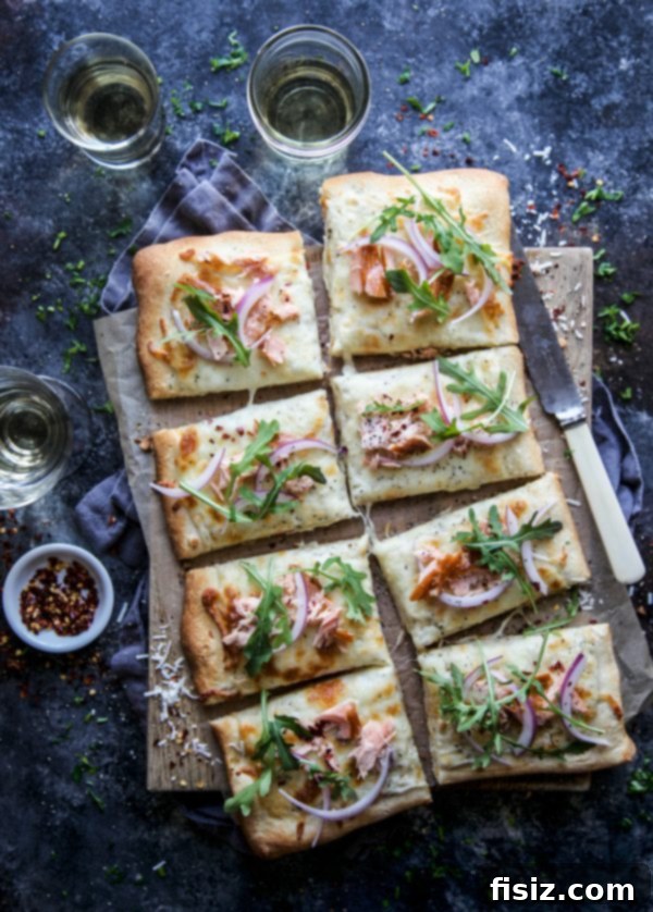 Ingredients for Smoked Salmon White Pizza laid out on a kitchen counter