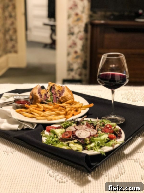Gourmet Spruce Burger with fries and wine from Hotel Boulderado's Spruce Farm and Fish