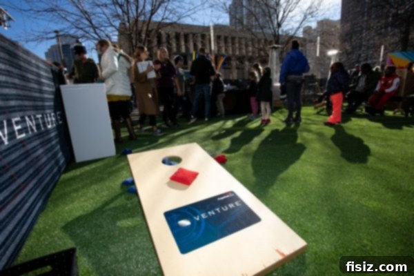 Adults playing a lively game of giant Jenga at the Capital One Destination Venture Dome event